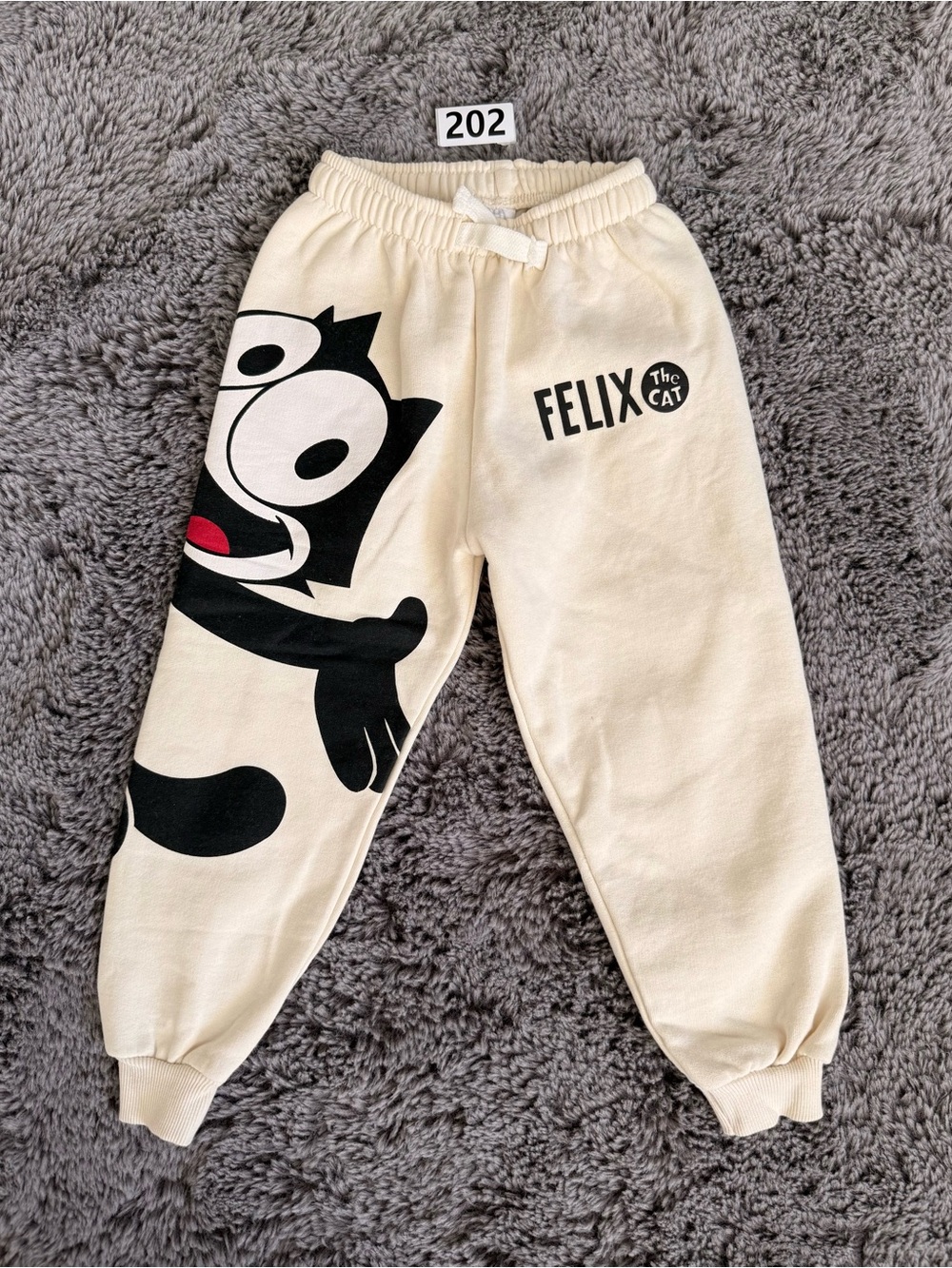 Zara Cream Sweatpants with Black Felix the Cat Graphic and Red Accent